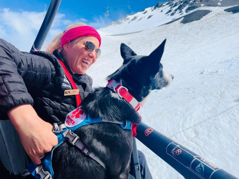 Lady and her dog on a ski chairlift