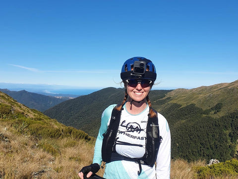 Holly Weston on a Bike with hill view