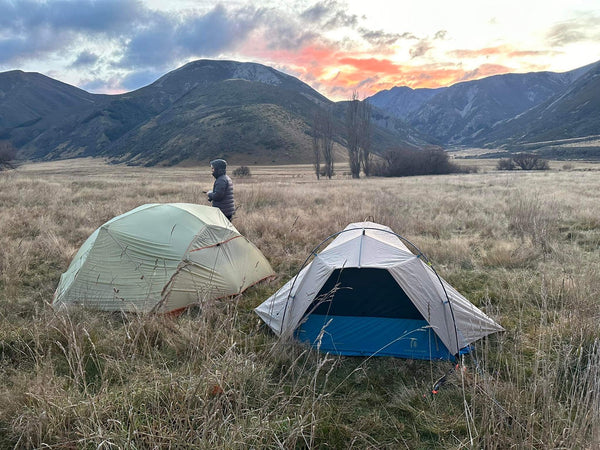 two tents and the sunset/sunrise
