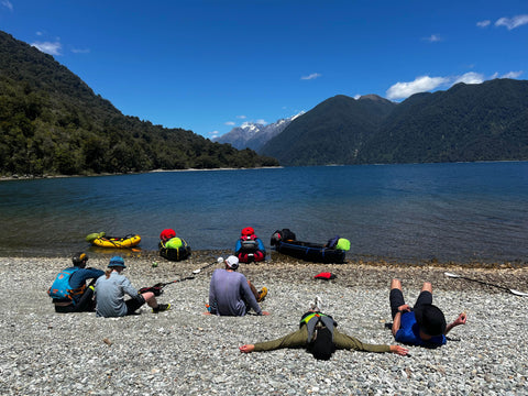 people relaxing lake side on the weat coast