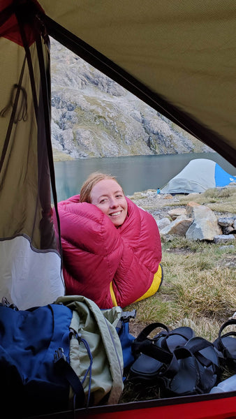 holly weston by a tent - she loves adventure!