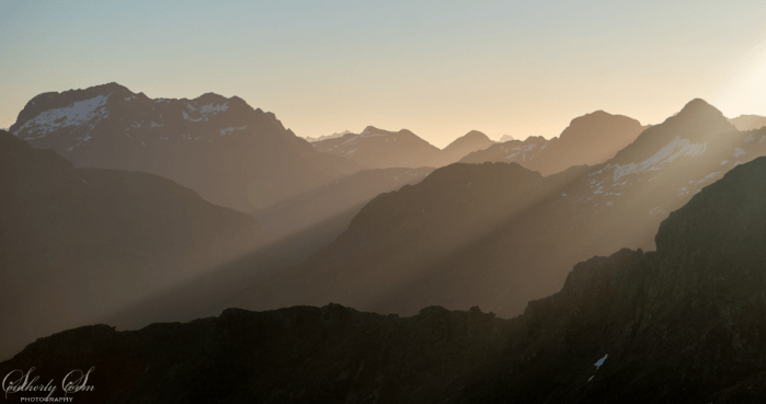 Light Rays over Mountain Range, New Zealand.