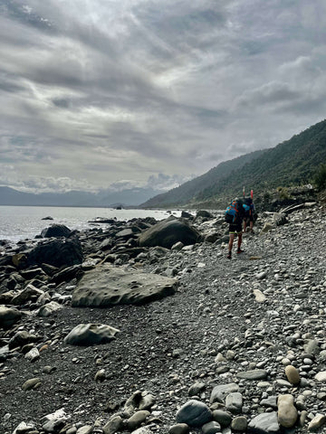 people walking on the rocky shores on the west coast