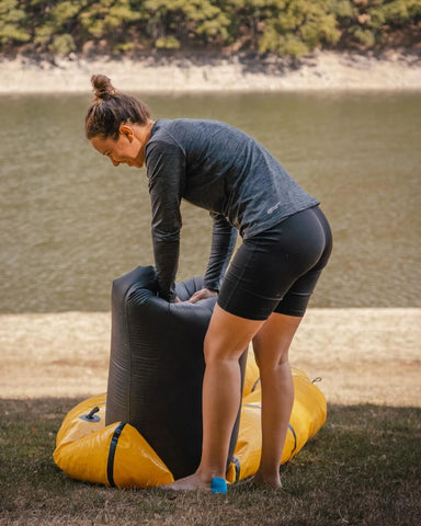 Women inflating packraft 