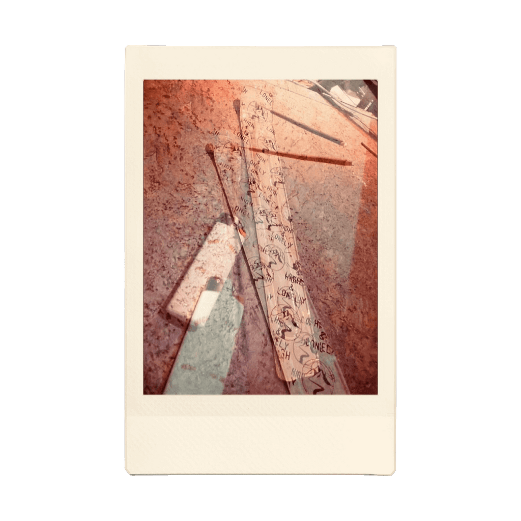 A double exposed image of an incense burner with a lighter beside it and a lit stick