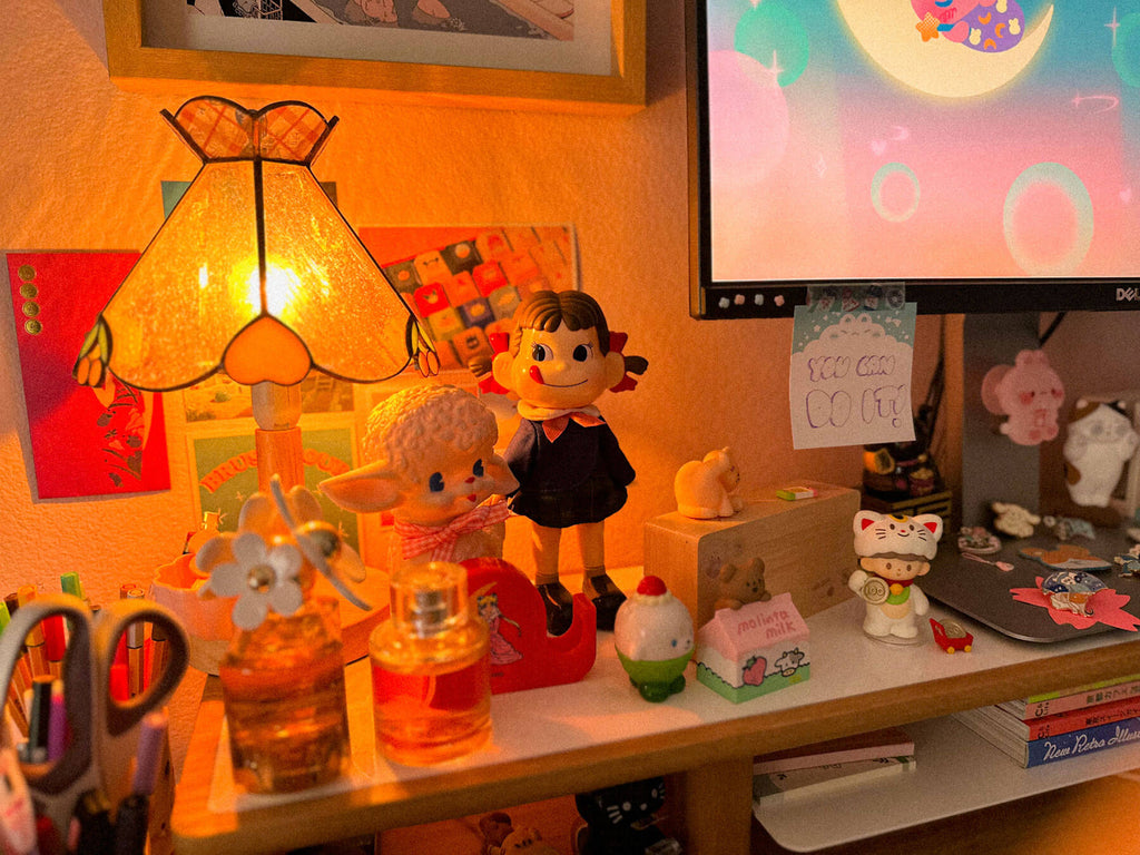 A glimpse of more treasures - cherry lamp by Korean brand you r hythm, my peko-chan doll, lucky cats, vinyl toys, a knockoff Sailor Moon tape dispenser, etc