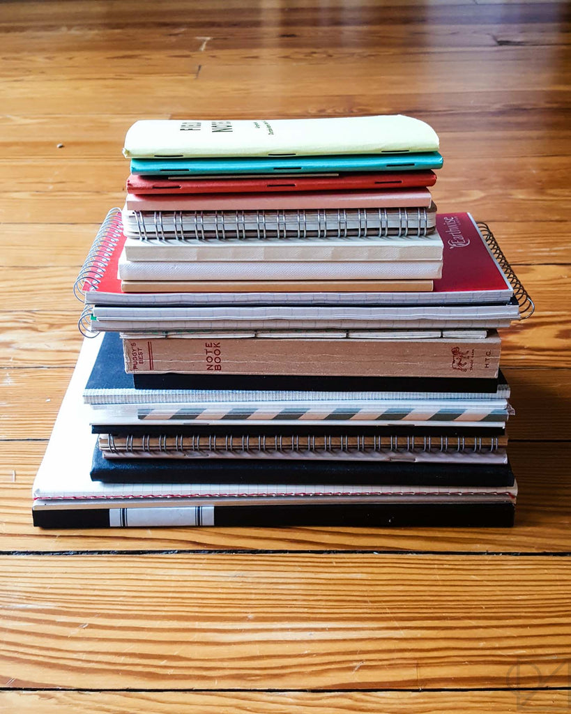 my stack of notebooks-in-waiting