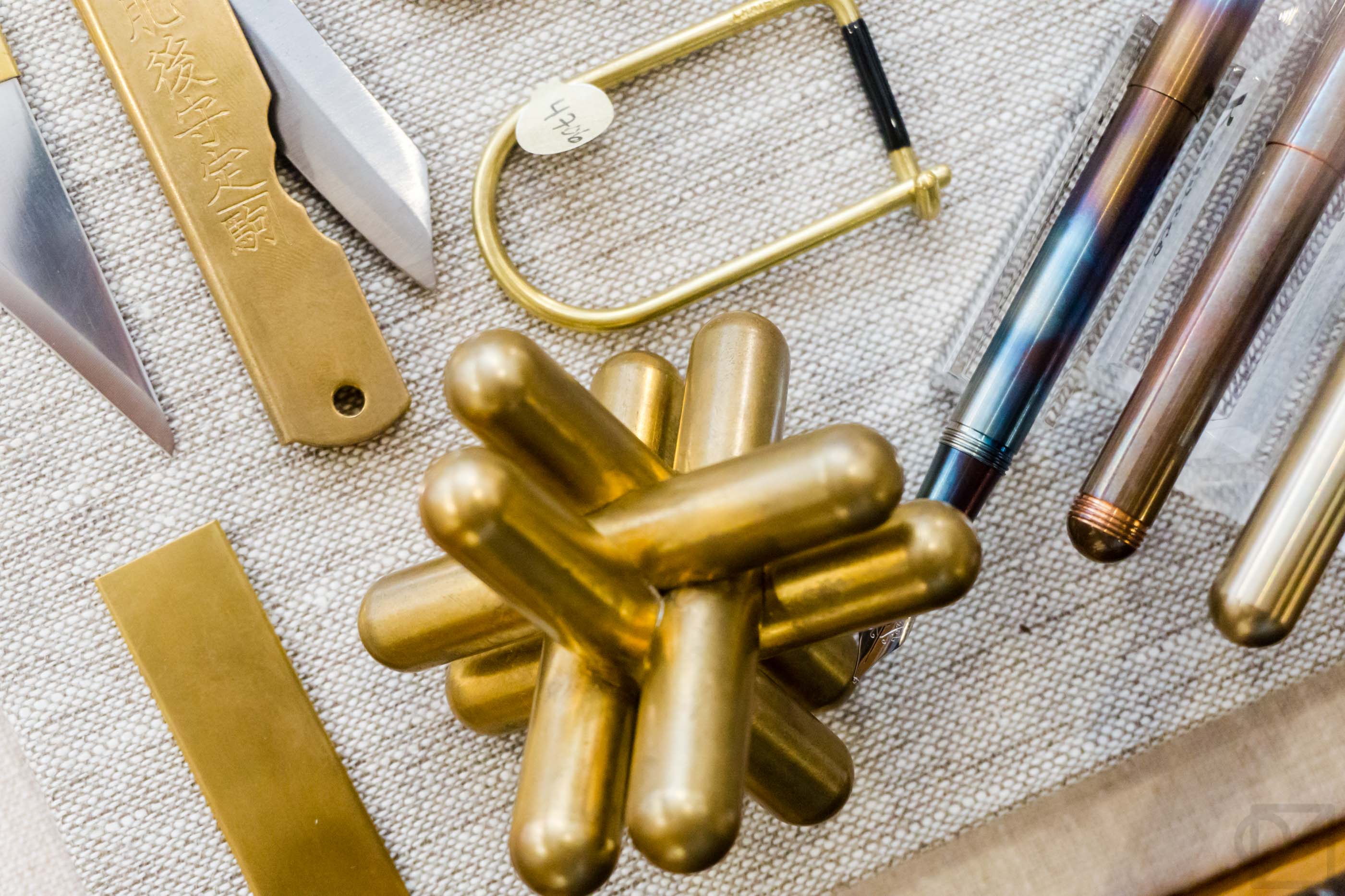 Brass desk accessories glinting in our main case.