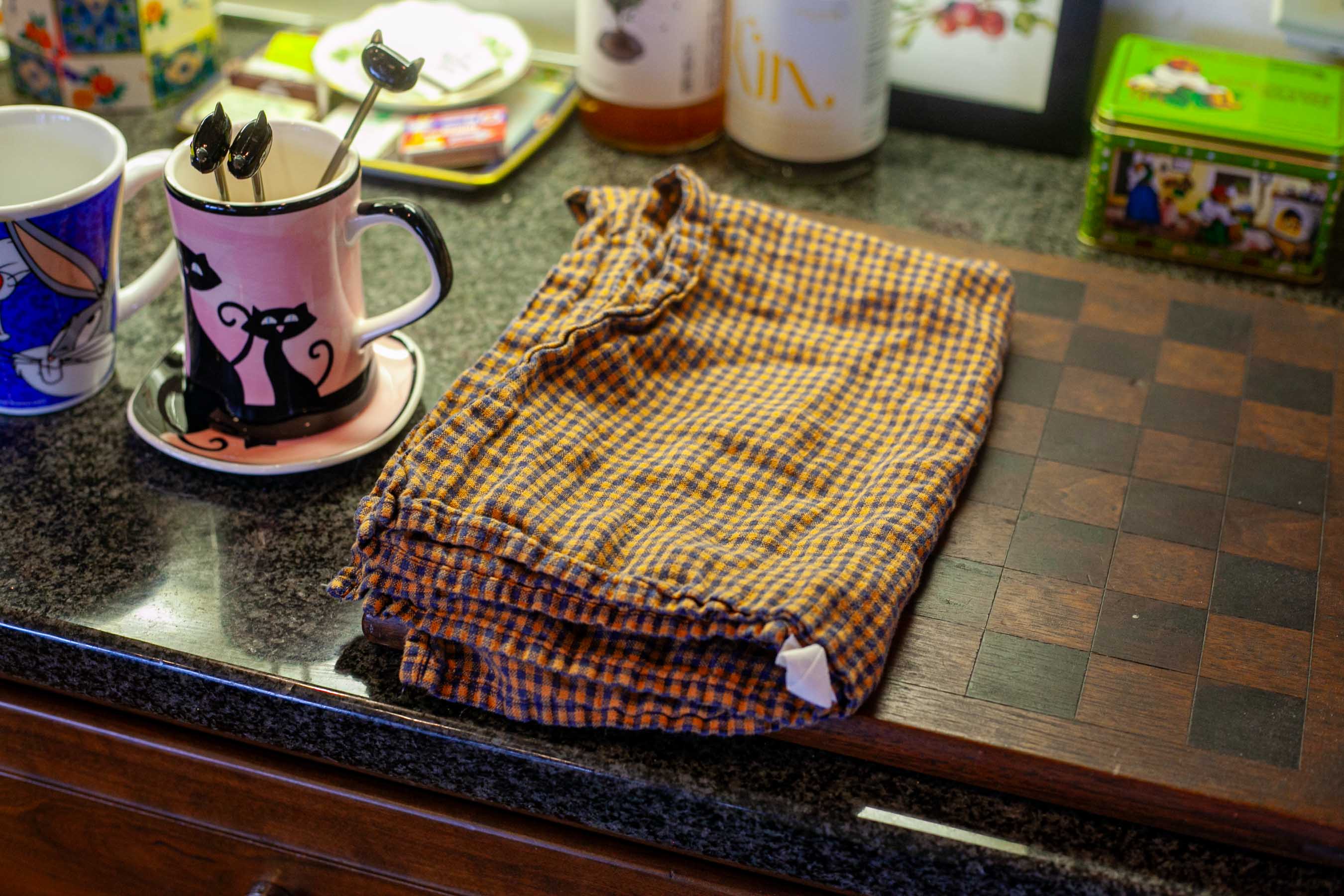 Well loved antique wood pairs well with Fog Linen Work kitchen cloths and favorite mugs in Liz's kitchen.