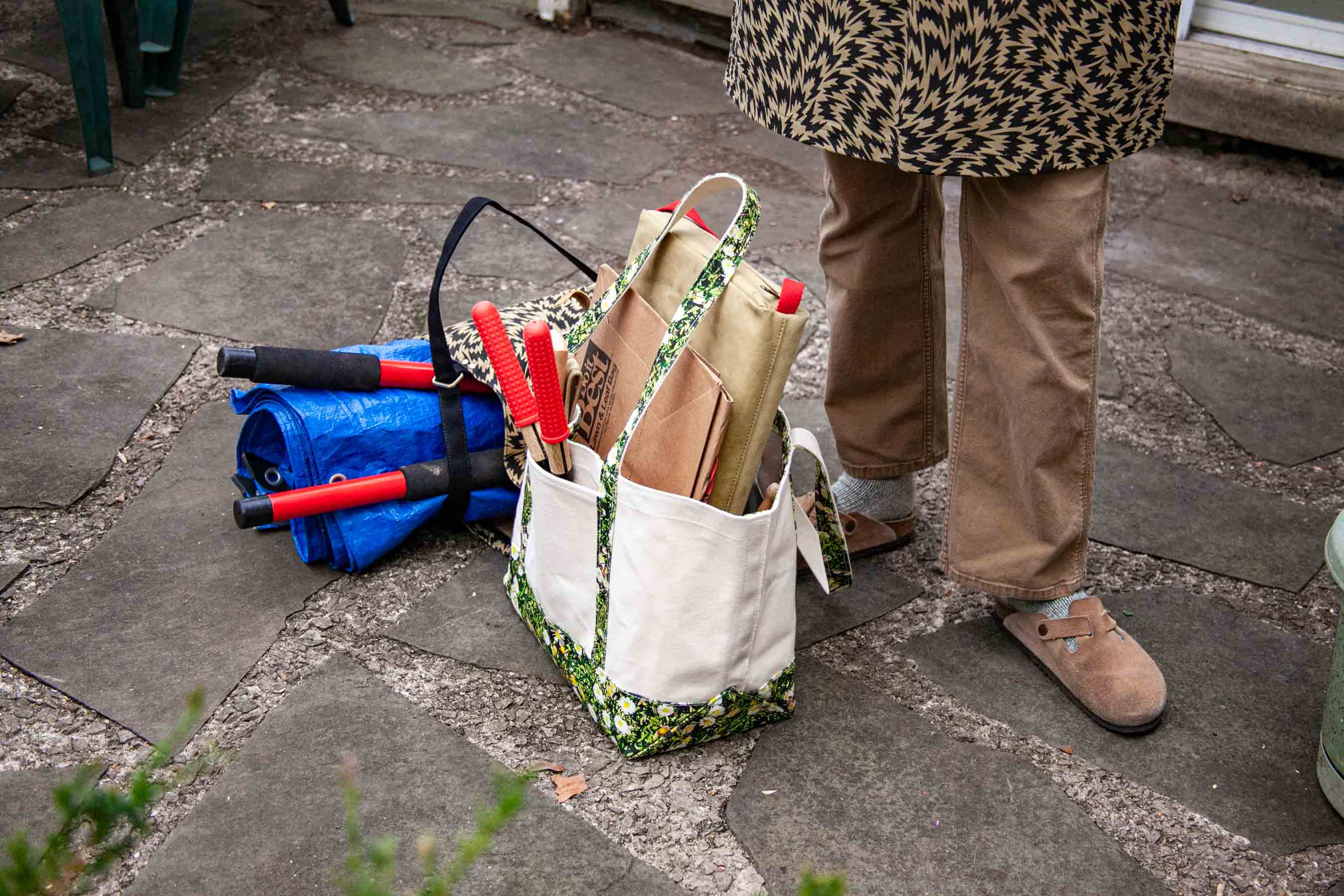 Yardwork supplies are gathered and ready to work.