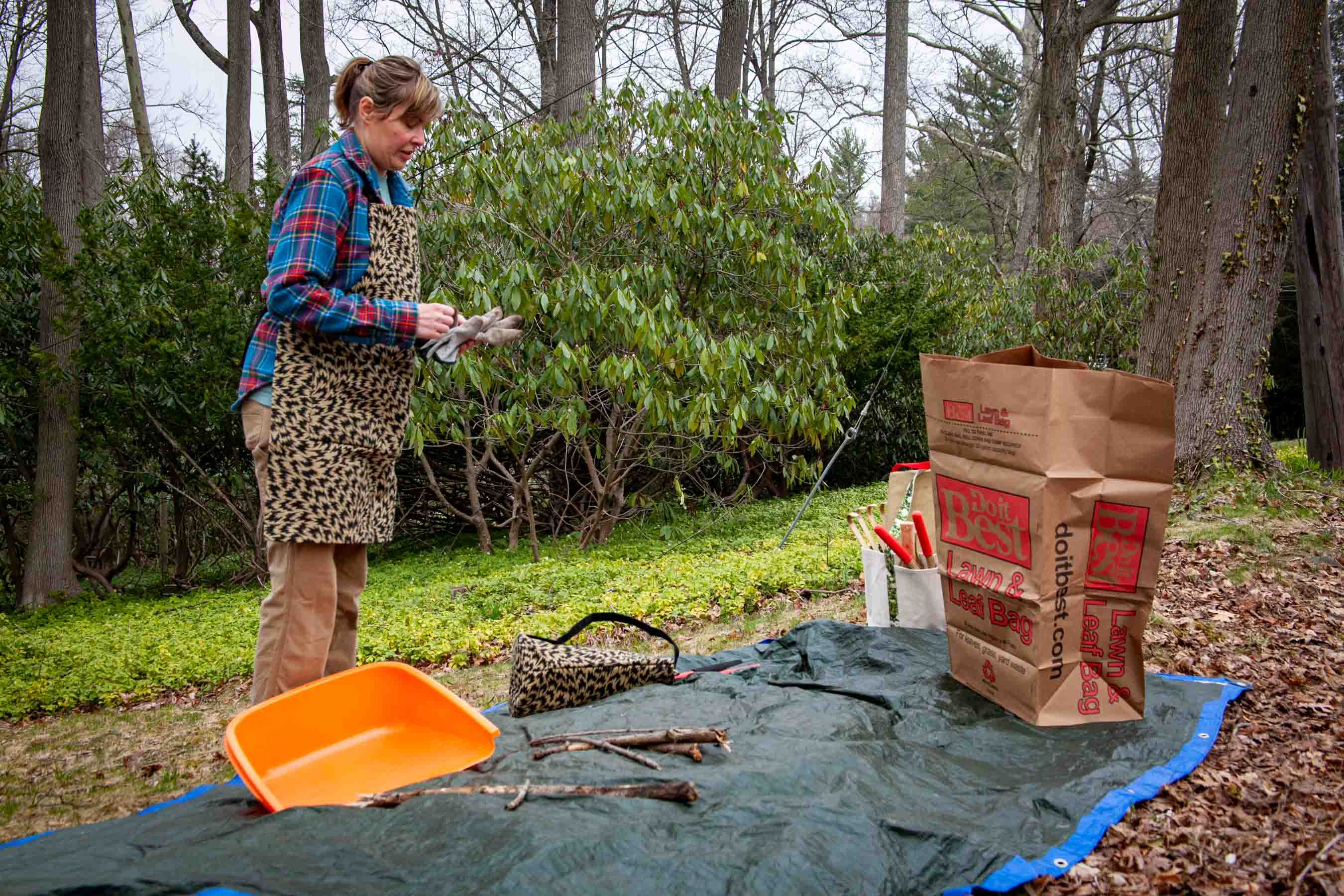 The tarp and tools are spread out and Liz gets to work.