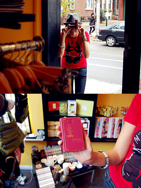 Grace, an early shop employee (hi Grace!), making the merchandise look good.