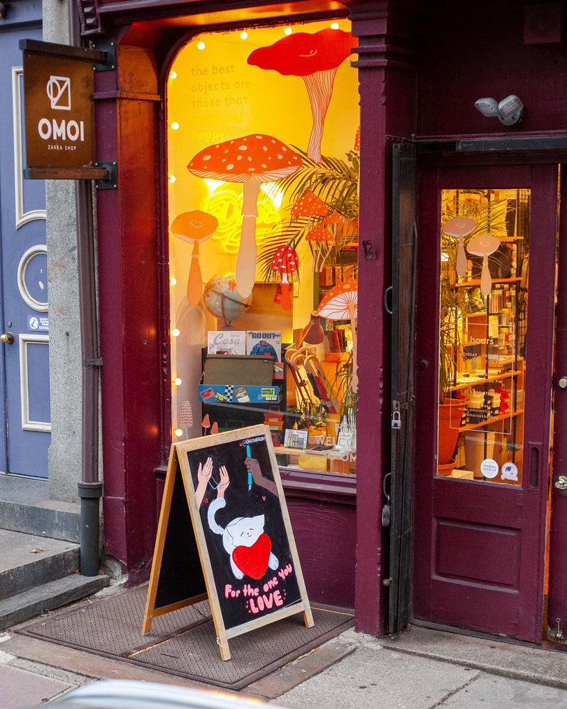 The DINER sign glow went so well with our new window art by Madeleine Conover, a local artist whose goods we sell.