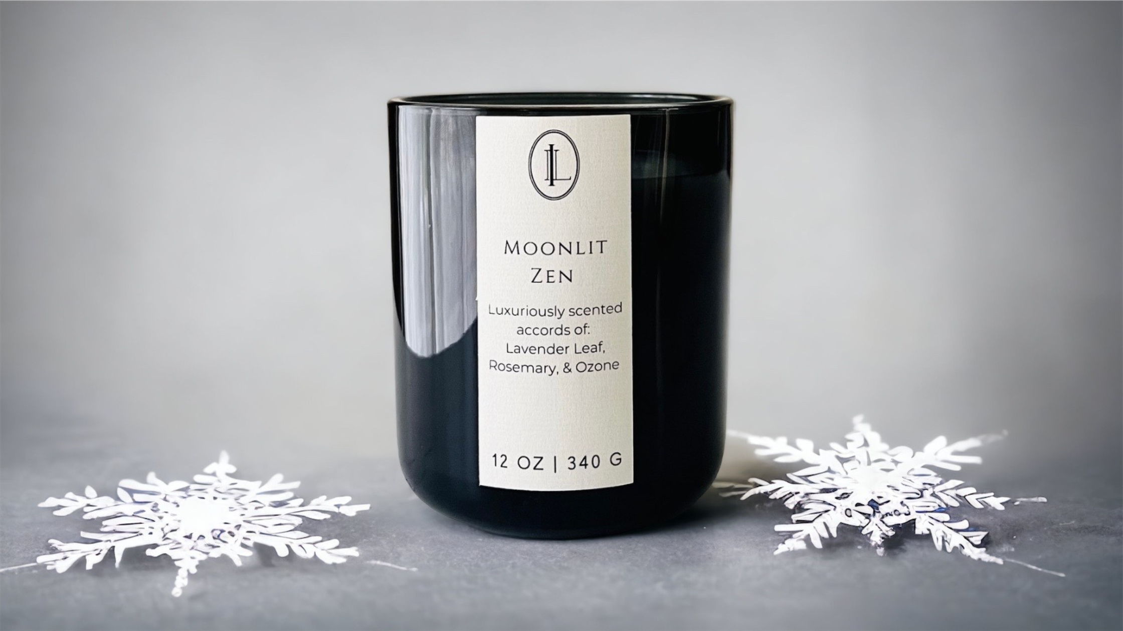 Image of Moonlit Zen Candle on gray background with snowflakes