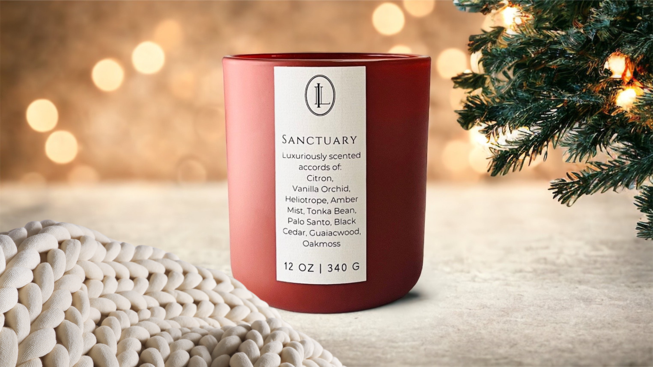 image of Sanctuary candle on Christmas theme background with cream cable knit blanket