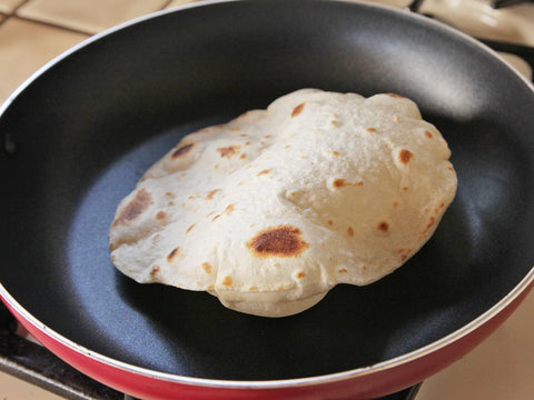 Tortilla heating in a frying pan