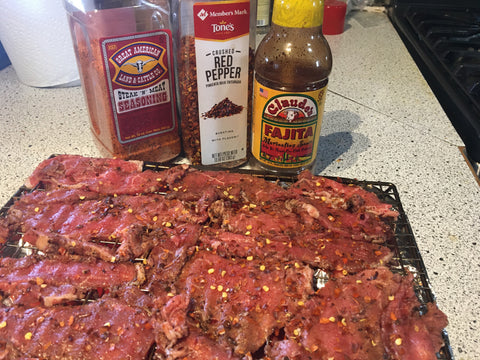 Cut strips of beef marinated with Claude's Fajita Marinade and prepared with Great American Seasoning