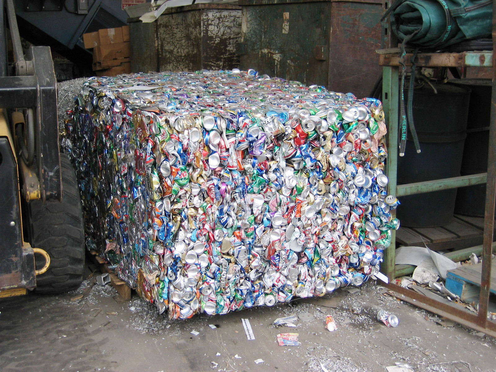 Aluminum cans waiting to be recycled in a bale
