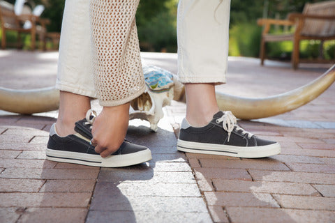 woman wearing arch support sneakers