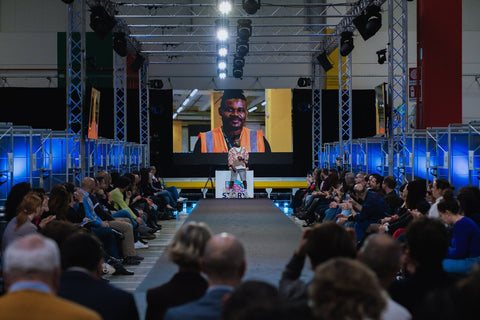 One of the people working at Amazon Italy who walked the runway in the dress designed by students from IED Rome