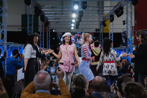 Some of the models who walked the runway high-five during the final runway show