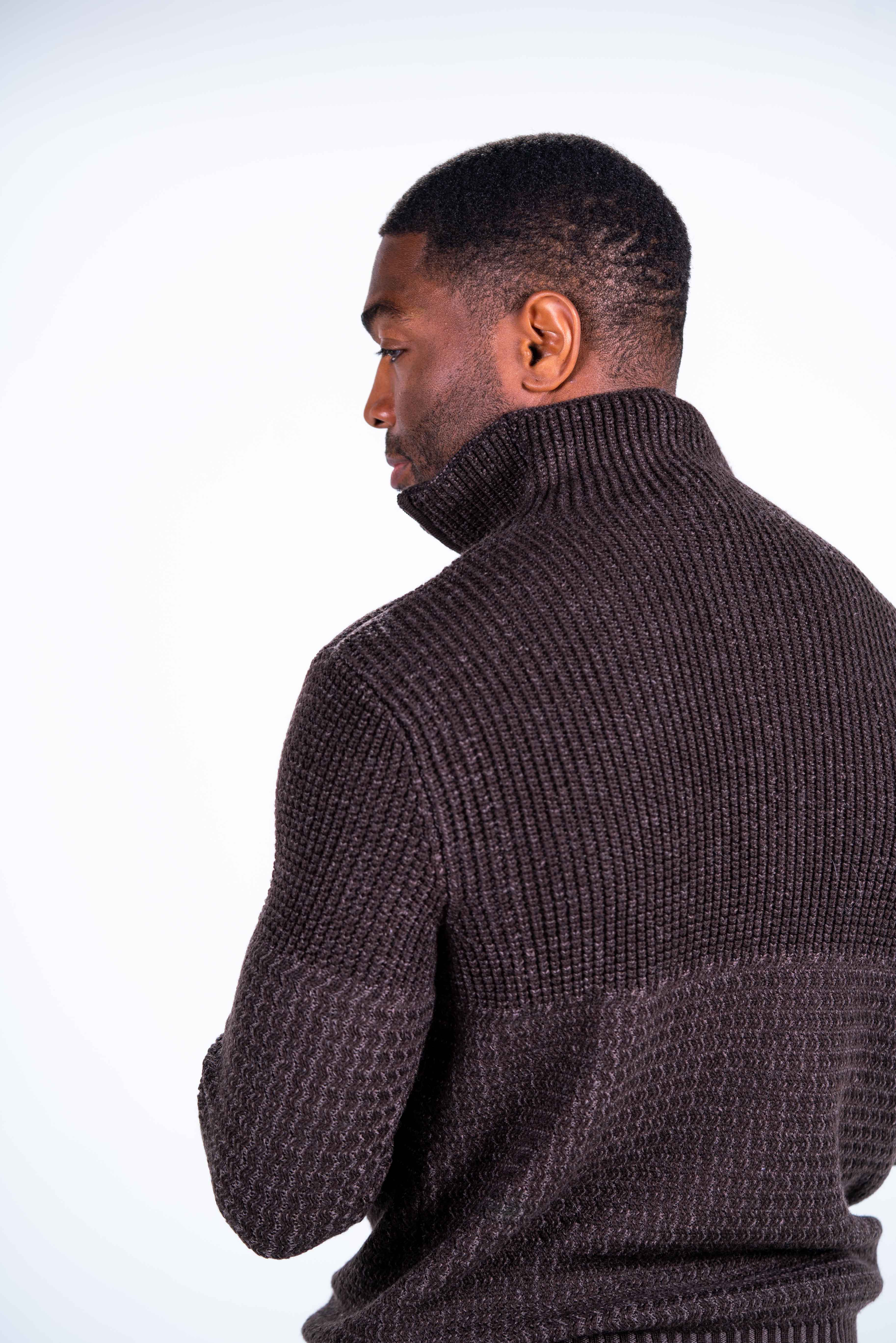 Diverse knit patterns and color shades on the Sahara make for interesting contrasts on this quarter-zip sweater. Sleeve ends, waistband, and standup collar are rib-knit, and either side of the zipper line is trimmed. The silver zipper pull highlights the diverse knit patterns.