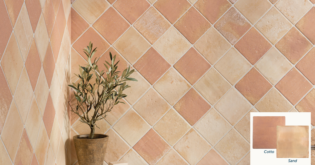 A bathroom wall with beige and peach wall tiles