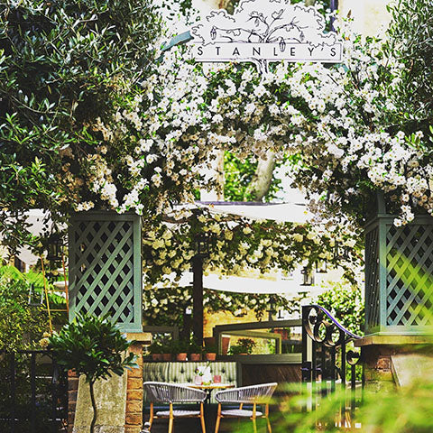 table outside at Stanley's where guests can drink Wild Idol non alcoholic sparkling rose