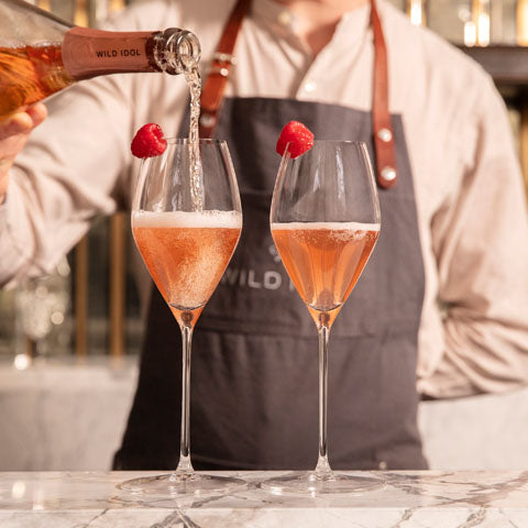 Two Summer Solstice Cocktails made with Wild Idol alcohol free sparkling wine