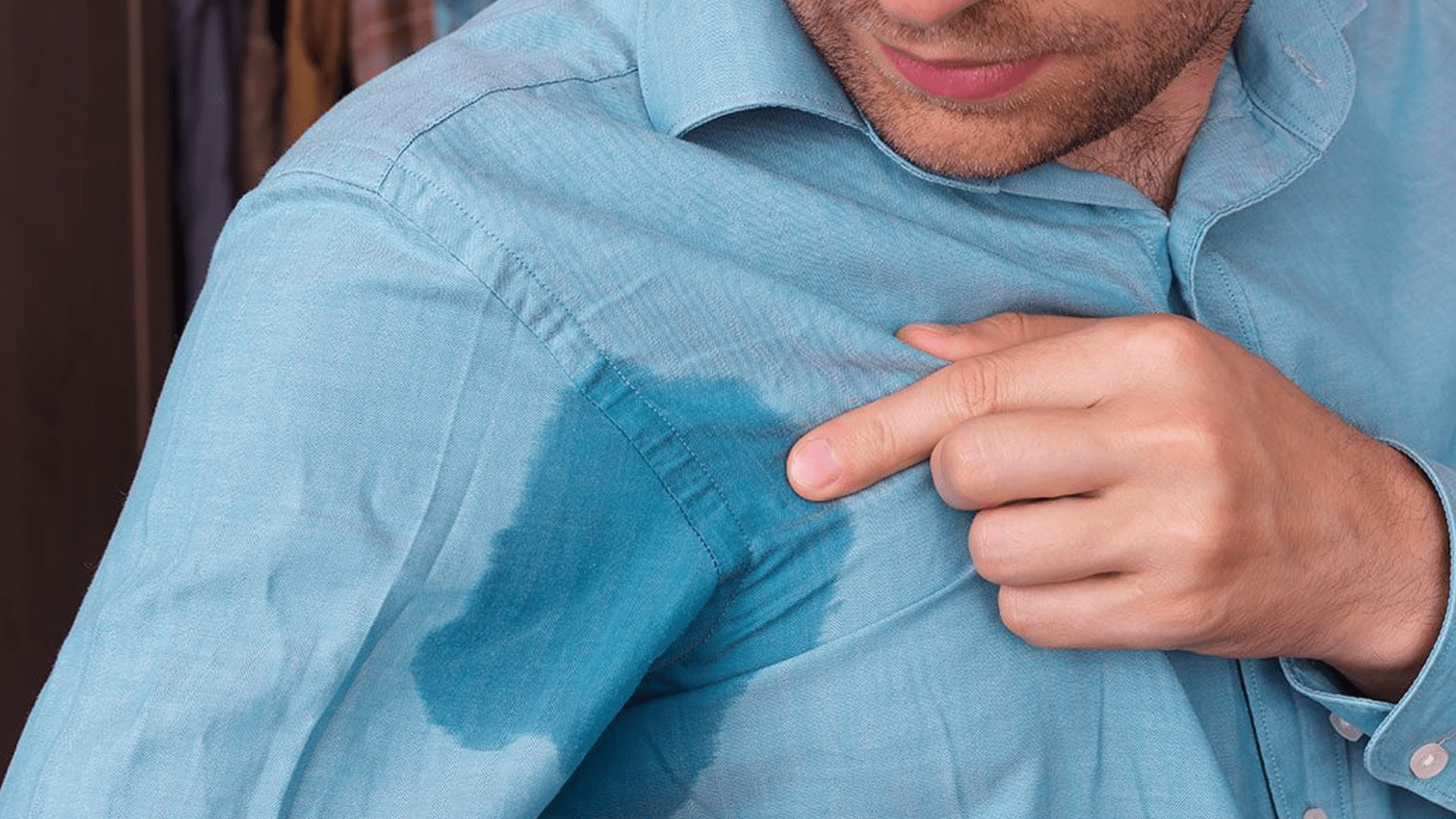 man sweaty armpit showing through blue shirt