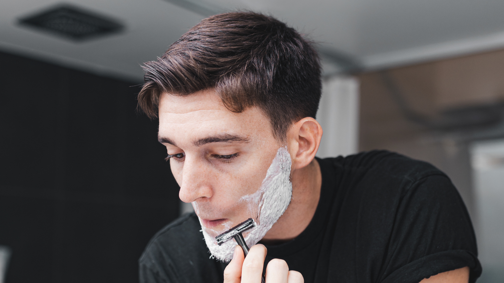 Man shaving face