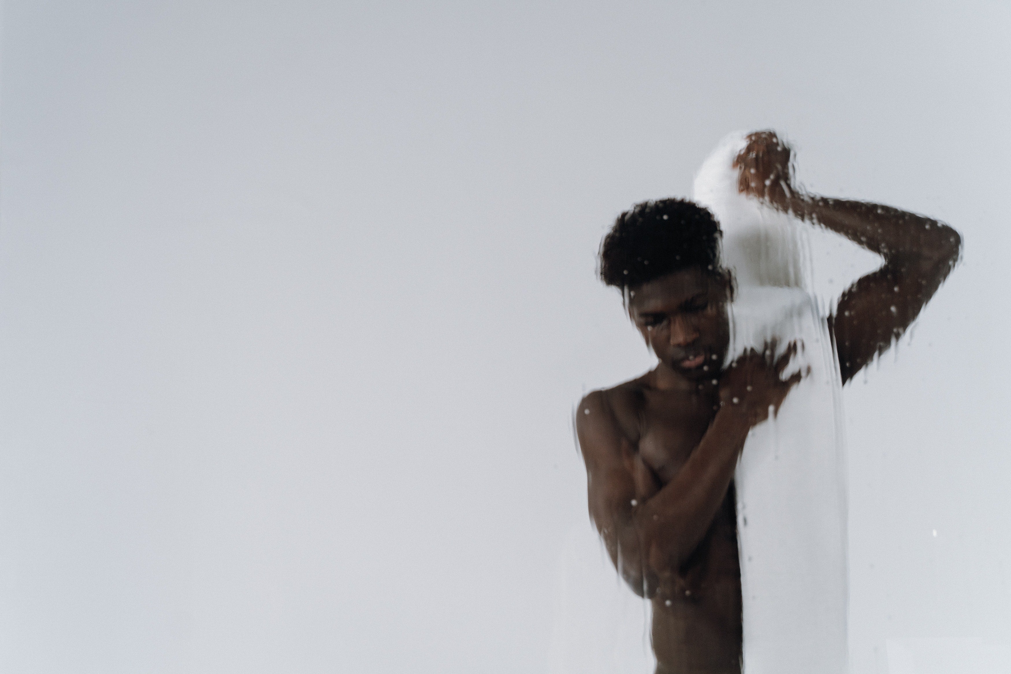 Man drying himself after a shower