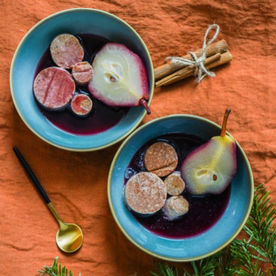 Cinnamon parfait with mulled wine pears in two bowls