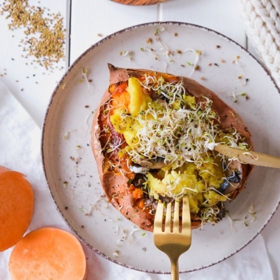 Stuffed sweet potato with sprouts and egg