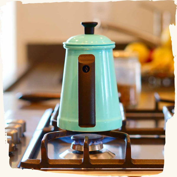 Blue kettle on a stove