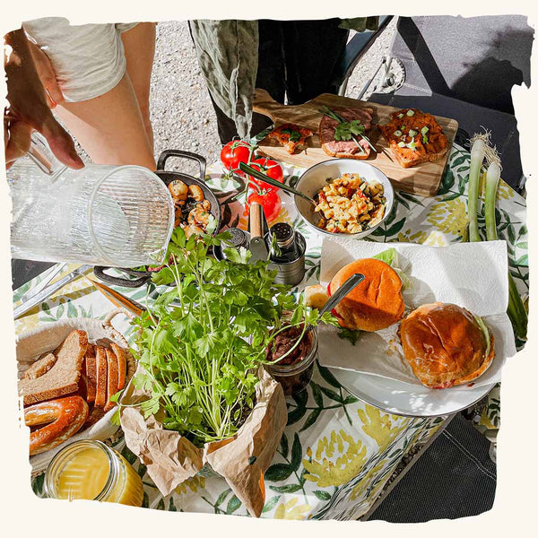 Colorful camping table set with vegan delicacies