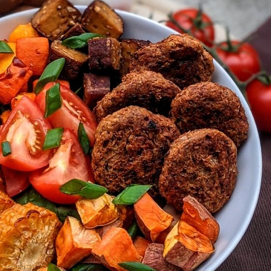 Vegan meatballs on a colorful salad bowl
