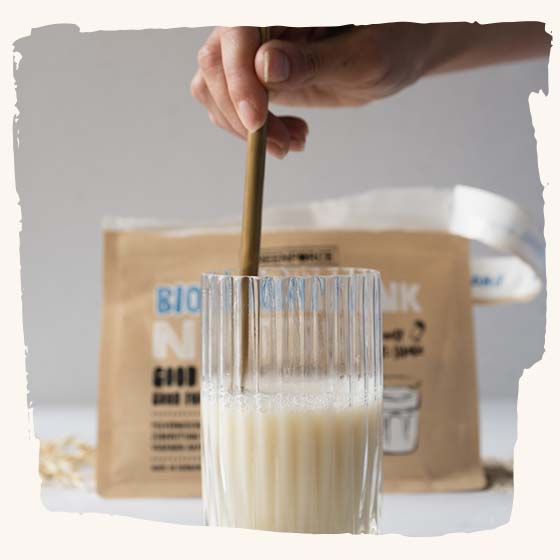 Oat milk glass with spoon