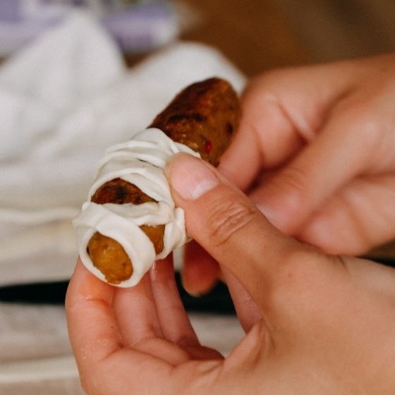 Vegan bratwursts wrapped in puff pastry