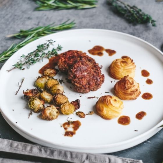 Side view of meatball with gingerbread sauce