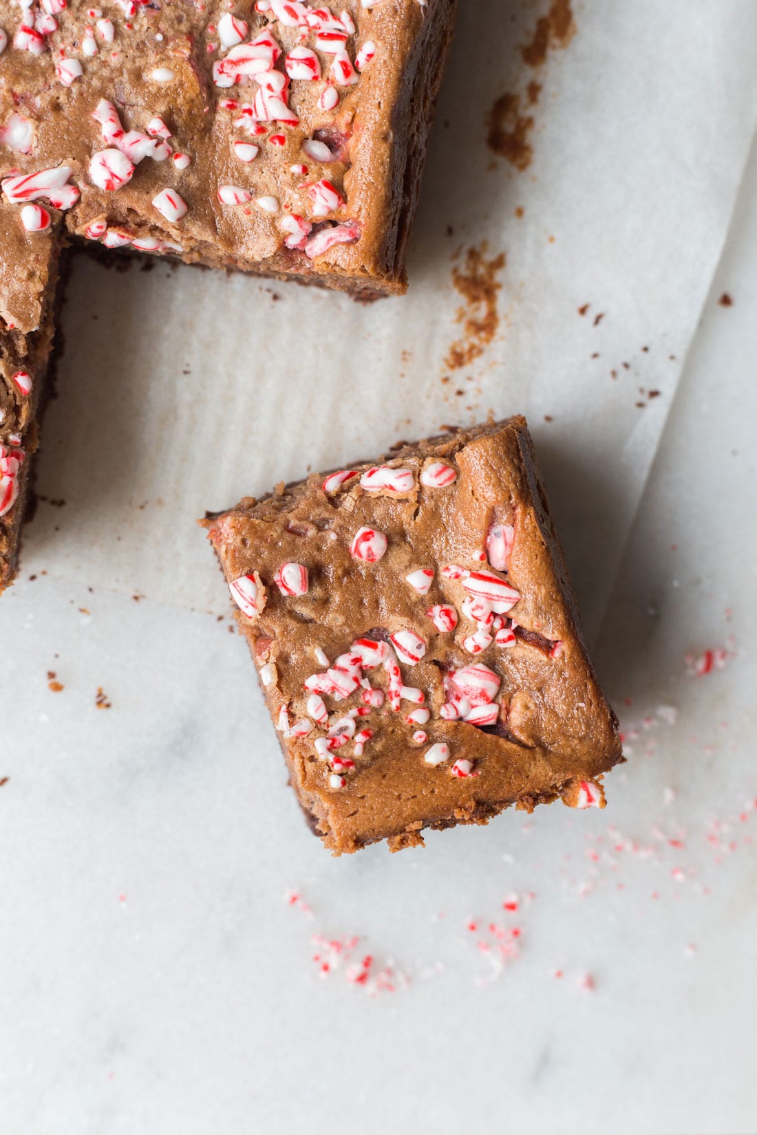 Picture of the top of Miss Jones Baking Co Chocolate Peppermint Butter Bar with chunks of peppermint on top