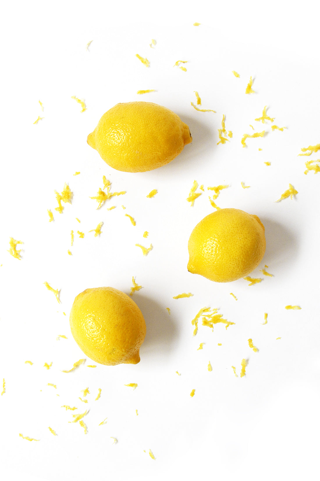 Image from above of three lemons around zest used for Miss Jones Baking Co Blackberry Buttermilk Donuts