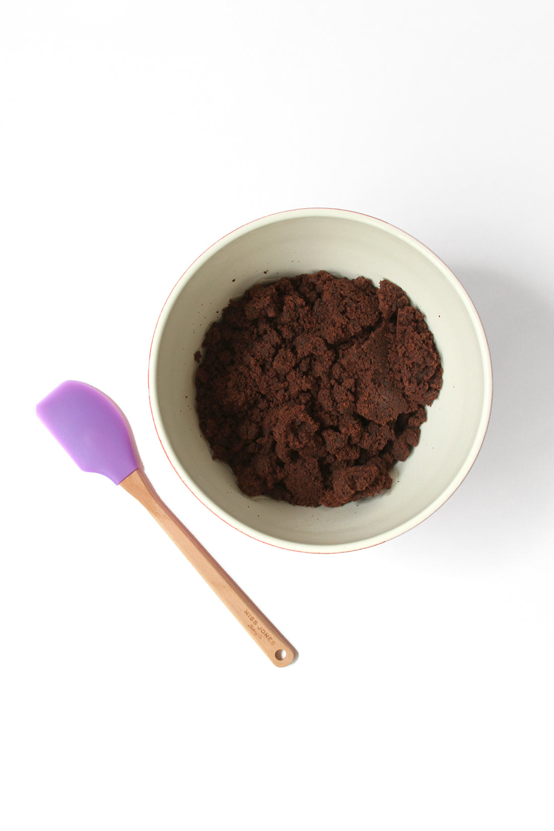 Image of Miss Jones Baking Co Brownie Batter Crinkle Cookie Sandwiches batter in mixing bowl next to purple spatula