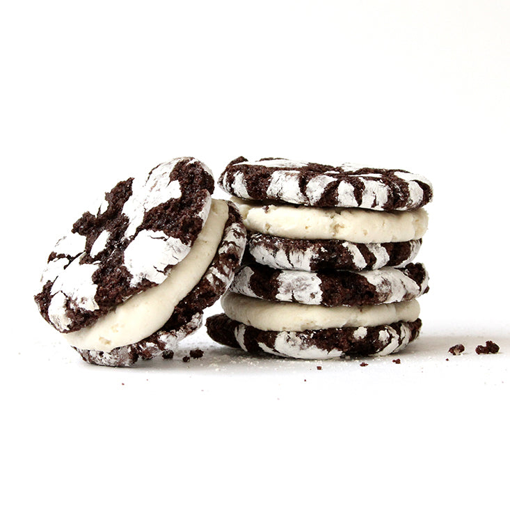 Image of one leaning against two stacked Miss Jones Baking Co Brownie Batter Crinkle Cookie Sandwiches