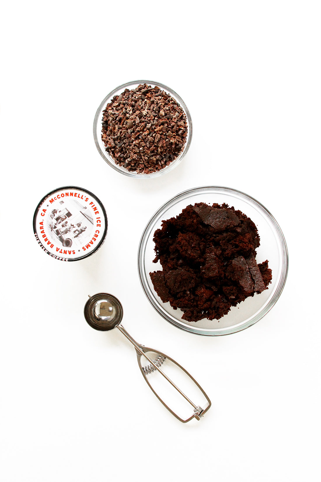 Image from above of brownie crumbles, an ice cream scoop and McConnell's Fine Ice Cream used for Miss Jones Baking Co Coffee Break Shake