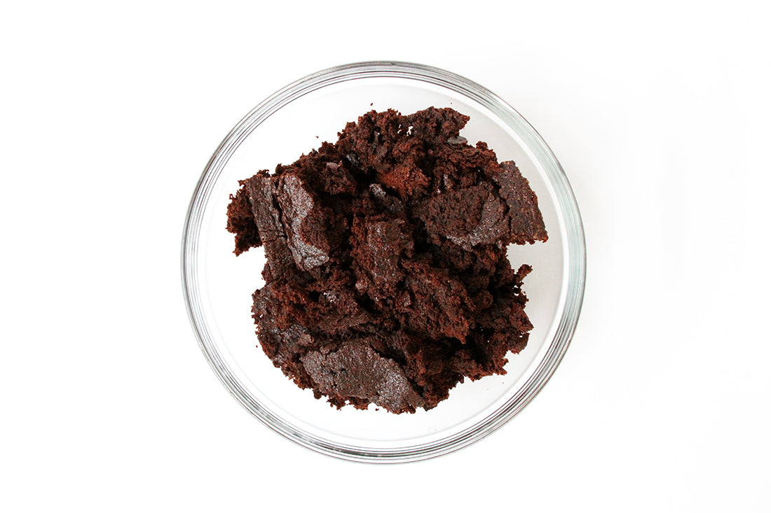 Image from above of brownie crumbles in a glass bowl used for Miss Jones Baking Co Coffee Break Shake