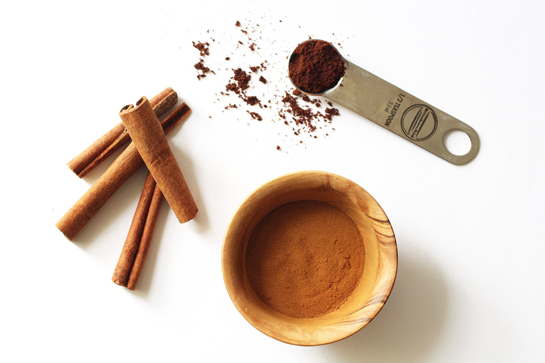 Image of cinnamon sticks, powder, and other spices used for Miss Jones Baking Co Carrot Spice Cakes