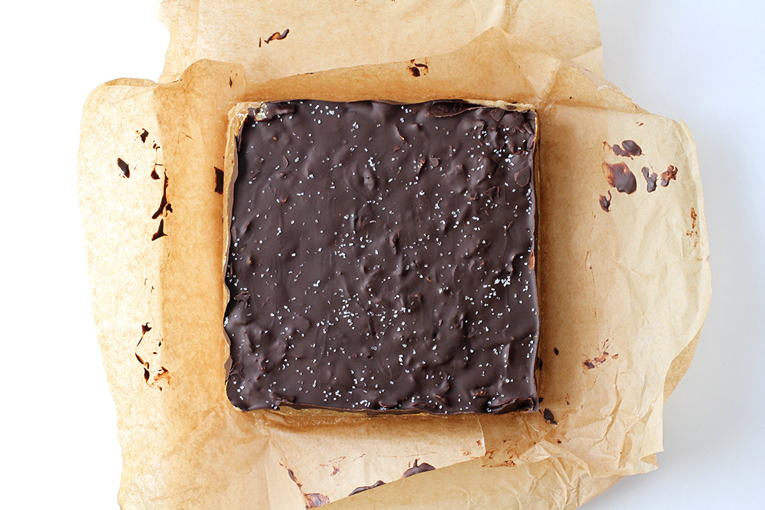 Image from above of Miss Jones Baking Co Cash Money Millionaire Bars on top of parchment paper