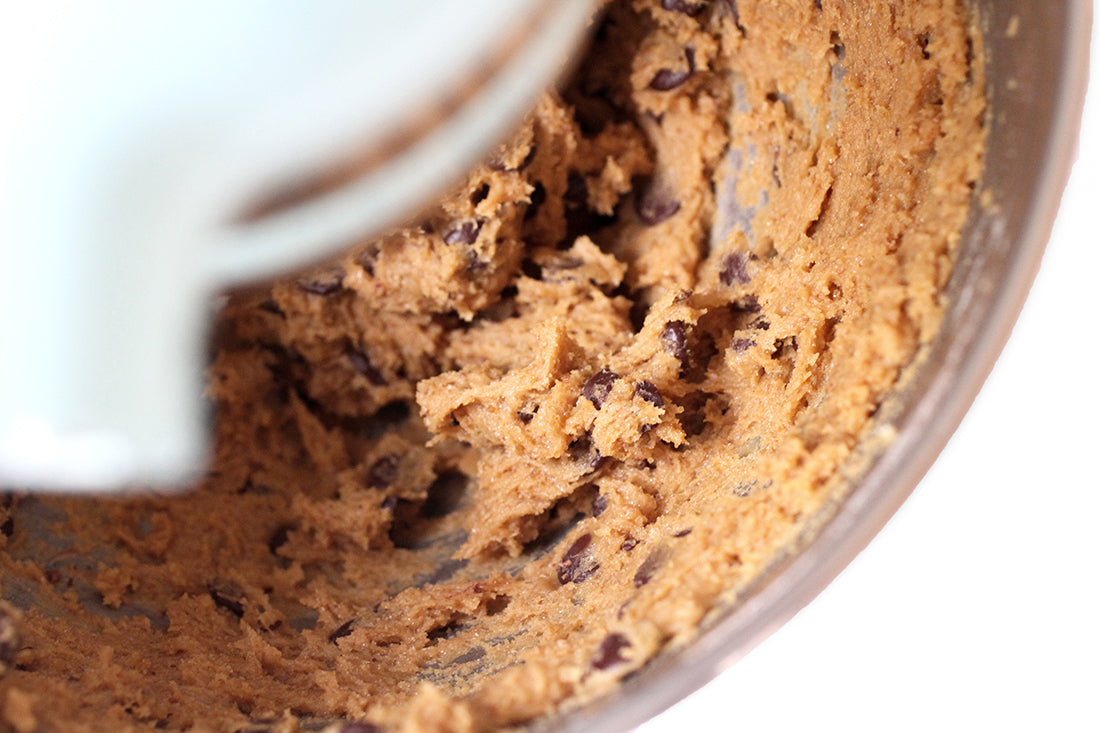 A close up image of cookie dough in the KitchenAid mixer used for Miss Jones Baking Co Chocolate Chip Brownie Skillet