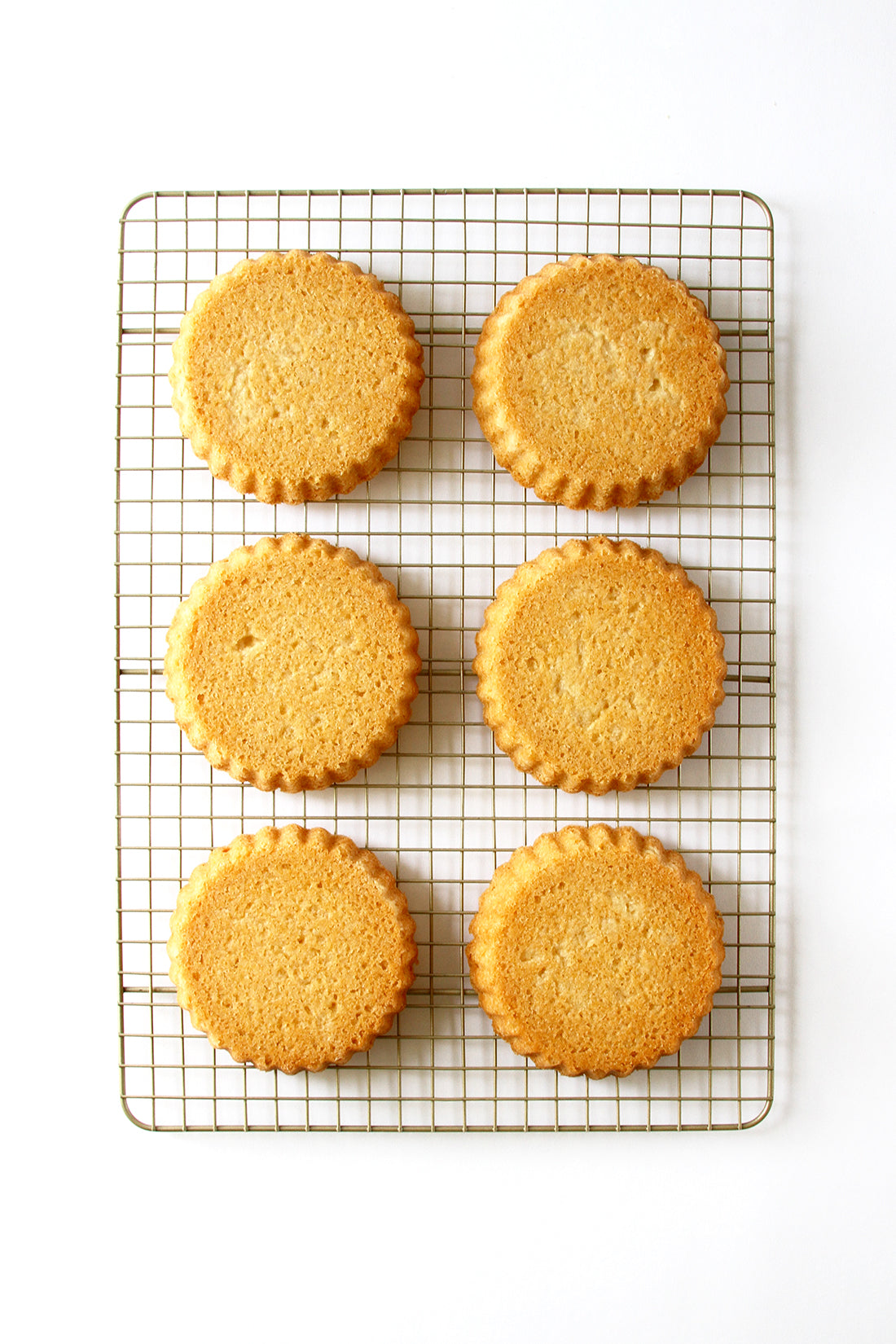 Image of six crusts on a baking rack for Miss Jones Baking Co Fruit Cart Tarts recipe